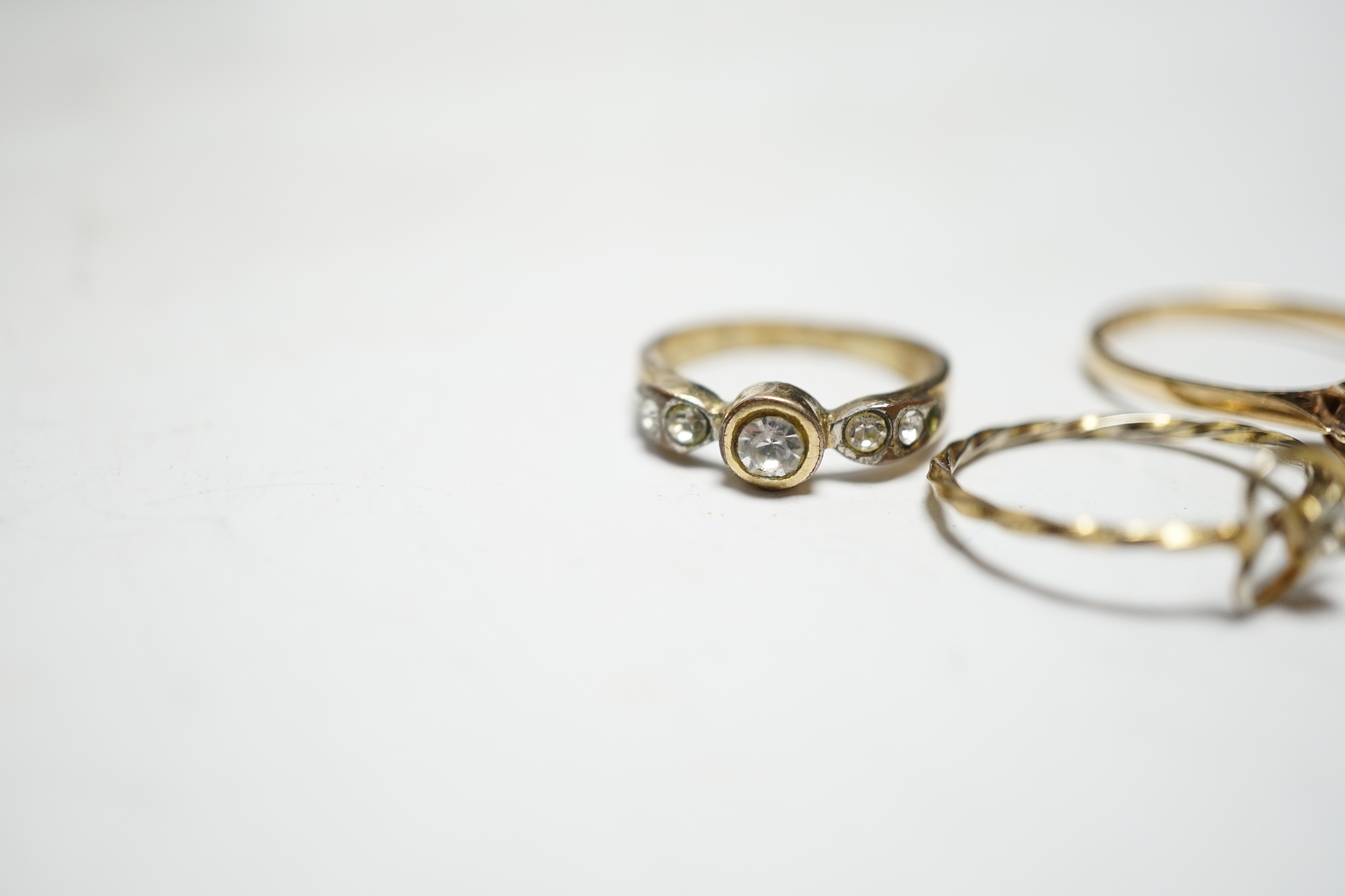 Two 9ct and gem set rings, including diamond chip half eternity and two other rings.